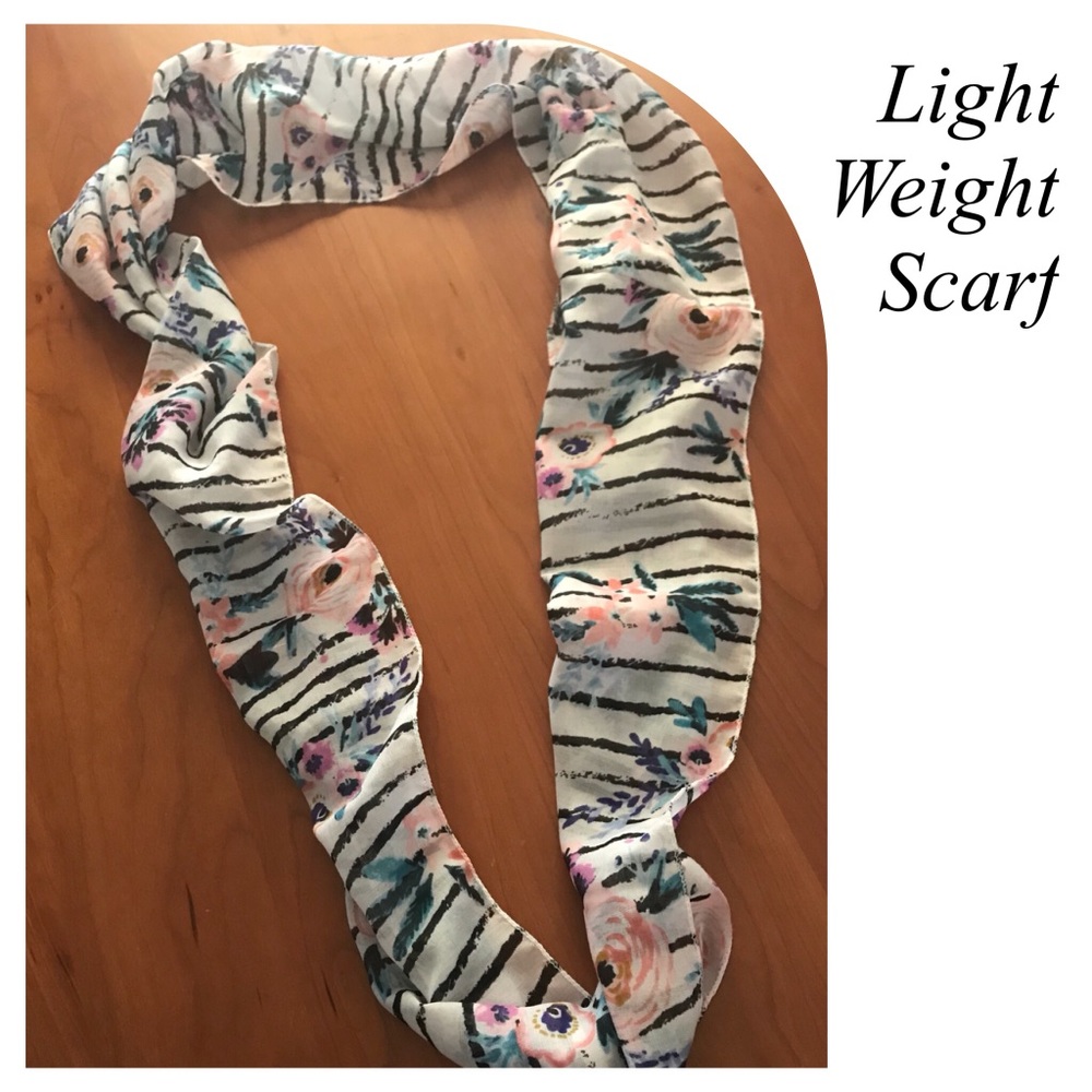 Very pretty scarf almost sheer material. Cute.